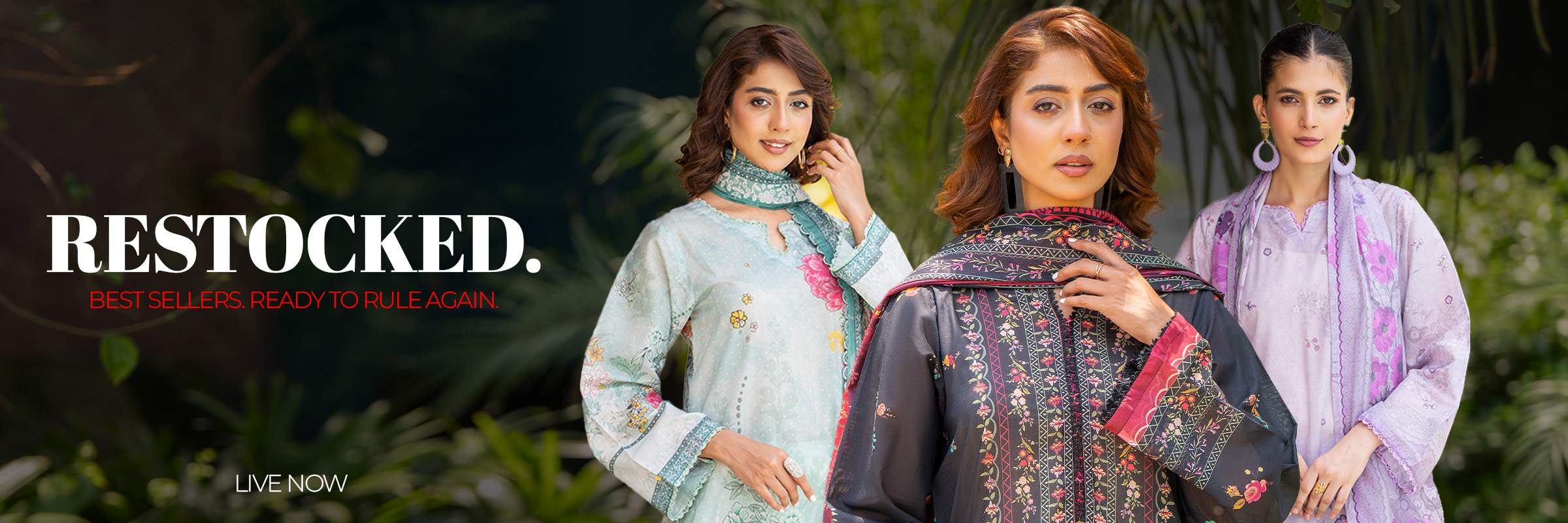 Three women wearing patterned outfits with a 'Restocked' banner above them.